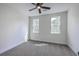 Bedroom with carpet, neutral walls, and dual windows letting in natural light at 136 Mitch Ln, Holly Hill, SC 29059