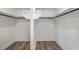 Spacious walk-in closet with custom shelving and wood flooring at 136 Mitch Ln, Holly Hill, SC 29059