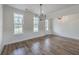 Light-filled dining room with hardwood floors and two large windows at 136 Mitch Ln, Holly Hill, SC 29059
