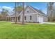 Attractive home with a side-entry garage and a spacious green lawn at 136 Mitch Ln, Holly Hill, SC 29059