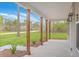 Spacious front porch featuring wooden columns and manicured landscaping at 136 Mitch Ln, Holly Hill, SC 29059