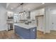 Modern kitchen featuring a large island, stainless steel appliances, and bright white cabinets at 136 Mitch Ln, Holly Hill, SC 29059