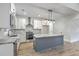 Modern kitchen featuring stainless steel appliances, an island, and bright white cabinets at 136 Mitch Ln, Holly Hill, SC 29059