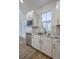 Bright kitchen with a stainless steel dishwasher and microwave with granite countertops at 136 Mitch Ln, Holly Hill, SC 29059