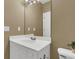 Neutral bathroom with a white vanity, large mirror, and a toilet in a well-lit space at 1362 Kingsford Ln, Mount Pleasant, SC 29466