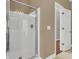 Well-lit bathroom featuring a tiled floor and a glass-enclosed shower, exemplifying a modern and clean design at 1362 Kingsford Ln, Mount Pleasant, SC 29466