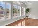 Bedroom with large windows and shutter blinds, letting in light over the laminate wood flooring at 1362 Kingsford Ln, Mount Pleasant, SC 29466