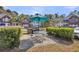 Outdoor community space with picnic table, umbrella, grilling station and parking area at 1362 Kingsford Ln, Mount Pleasant, SC 29466
