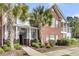 Charming condominium exterior with lush landscaping and classic brick and siding accents at 1362 Kingsford Ln, Mount Pleasant, SC 29466