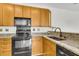 Spacious kitchen features granite countertops, wood cabinets and a sink at 1362 Kingsford Ln, Mount Pleasant, SC 29466