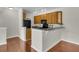 Modern kitchen featuring a breakfast bar with elegant countertops and stainless-steel appliances, ideal for casual dining at 1362 Kingsford Ln, Mount Pleasant, SC 29466