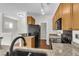 Well-lit kitchen features granite countertops, wood cabinets and stainless appliances at 1362 Kingsford Ln, Mount Pleasant, SC 29466