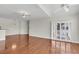 Open-concept living area with hardwood floors, contemporary ceiling fans, and sliding doors that provide ample light at 1362 Kingsford Ln, Mount Pleasant, SC 29466