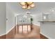 Expansive living room with gleaming hardwood floors and natural light that floods through plantation-shuttered windows at 1362 Kingsford Ln, Mount Pleasant, SC 29466