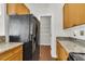 View of the kitchen pantry with wood look flooring and wire shelving at 1362 Kingsford Ln, Mount Pleasant, SC 29466