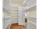 Spacious walk-in pantry with lots of storage space and door to kitchen at 1362 Kingsford Ln, Mount Pleasant, SC 29466
