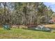 Scenic view of a pond with a fountain, surrounded by trees and a bench at 1362 Kingsford Ln, Mount Pleasant, SC 29466