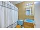 Traditional bathroom featuring a toilet and a vanity with a blue sink, combining functionality with classic design at 140 Wampee Curve, Summerville, SC 29485