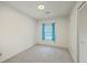 Minimalist bedroom with plush carpeting, a window with blue curtains, and ample space at 140 Wampee Curve, Summerville, SC 29485