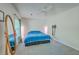 Bright bedroom with neutral carpet, large mirror, ceiling fan, and window bringing in lots of natural light at 140 Wampee Curve, Summerville, SC 29485