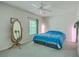 Bright bedroom with neutral carpet, large mirror, ceiling fan, and window bringing in lots of natural light at 140 Wampee Curve, Summerville, SC 29485