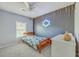 Stylish bedroom with a gray accent wall, decorative wood trim, and a cozy bed bathed in natural light at 140 Wampee Curve, Summerville, SC 29485