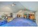 Spacious bonus room in the attic featuring carpeted floors and lighting at 140 Wampee Curve, Summerville, SC 29485