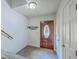 Inviting entryway with a decorative front door, tile flooring, and a coat rack at 140 Wampee Curve, Summerville, SC 29485