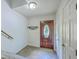 Inviting entryway with a decorative front door, tile flooring, and a coat rack at 140 Wampee Curve, Summerville, SC 29485