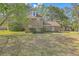 Charming two-story brick home with a well-maintained front yard and mature trees at 140 Wampee Curve, Summerville, SC 29485