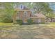 Beautiful brick home with a welcoming front entrance, complemented by manicured bushes and a lush lawn at 140 Wampee Curve, Summerville, SC 29485