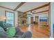 Bright, large living room with brick fireplace, wood beams, and ample space at 140 Wampee Curve, Summerville, SC 29485