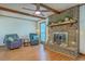 Inviting living room with hardwood floors, a brick fireplace, and comfortable seating at 140 Wampee Curve, Summerville, SC 29485