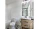 The bathroom has a wood vanity with a marble countertop, stylish fixtures, and star-patterned tile floors at 153 Mitch Ln, Holly Hill, SC 29059