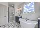 Elegant bathroom with a freestanding tub, glass shower, and stylish black fixtures at 153 Mitch Ln, Holly Hill, SC 29059