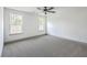 Bright bedroom with neutral carpet, large windows, and ample space, providing a comfortable living area at 153 Mitch Ln, Holly Hill, SC 29059