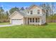 Charming two-story home with a two-car garage, a manicured lawn, and craftsman architecture at 153 Mitch Ln, Holly Hill, SC 29059