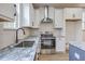 Modern kitchen showcasing stainless steel appliances, gray countertops, and white cabinets at 153 Mitch Ln, Holly Hill, SC 29059