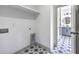 Bright laundry room featuring stylish tile floor and utility connections, providing a functional space at 153 Mitch Ln, Holly Hill, SC 29059