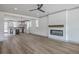 Spacious living room showcasing hardwood floors, a modern fireplace, and an open floor plan at 153 Mitch Ln, Holly Hill, SC 29059