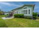 Well-maintained backyard with patio area, manicured lawn, and decorative shrubs and perimeter fencing at 1543 Watoga Way, Mount Pleasant, SC 29466