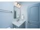 Bathroom featuring a single sink, large mirror, and a towel rack at 1543 Watoga Way, Mount Pleasant, SC 29466