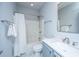Bathroom featuring a single sink, shower over tub, mirror, and white tiling at 1543 Watoga Way, Mount Pleasant, SC 29466