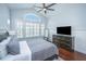 Comfortable bedroom with hardwood floors, a ceiling fan, and a large window at 1543 Watoga Way, Mount Pleasant, SC 29466
