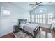 This bedroom features an arched window, plantation shutters, and modern decor at 1543 Watoga Way, Mount Pleasant, SC 29466