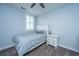 This bedroom has a ceiling fan, white windows with shutters, and white furniture at 1543 Watoga Way, Mount Pleasant, SC 29466