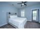 Light and airy bedroom featuring a gray wood-frame bed and private balcony at 1543 Watoga Way, Mount Pleasant, SC 29466