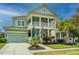 Charming two-story home with a double porch, green lawn and an attached two-car garage at 1543 Watoga Way, Mount Pleasant, SC 29466
