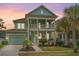 Inviting two-story home boasting double porches, a well-manicured lawn, and an attached two-car garage at 1543 Watoga Way, Mount Pleasant, SC 29466