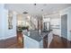 Spacious kitchen featuring a large island with seating, stainless steel appliances, and access to the dining area at 1543 Watoga Way, Mount Pleasant, SC 29466